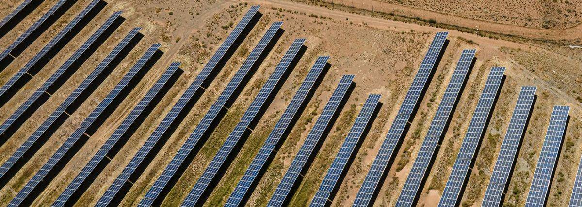 Aerial view of a solar energy installation in an arid landscape